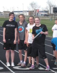 Bezanson Girls 15/16 relay team prepares for Heat 1 of the 4 x 100 relay