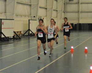 Hayden Hollowell (leading) placed second in the 3000m at the 2015 AA Age Group Indoor Provincials
